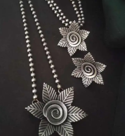 Silver look long chain pendant with earrings
