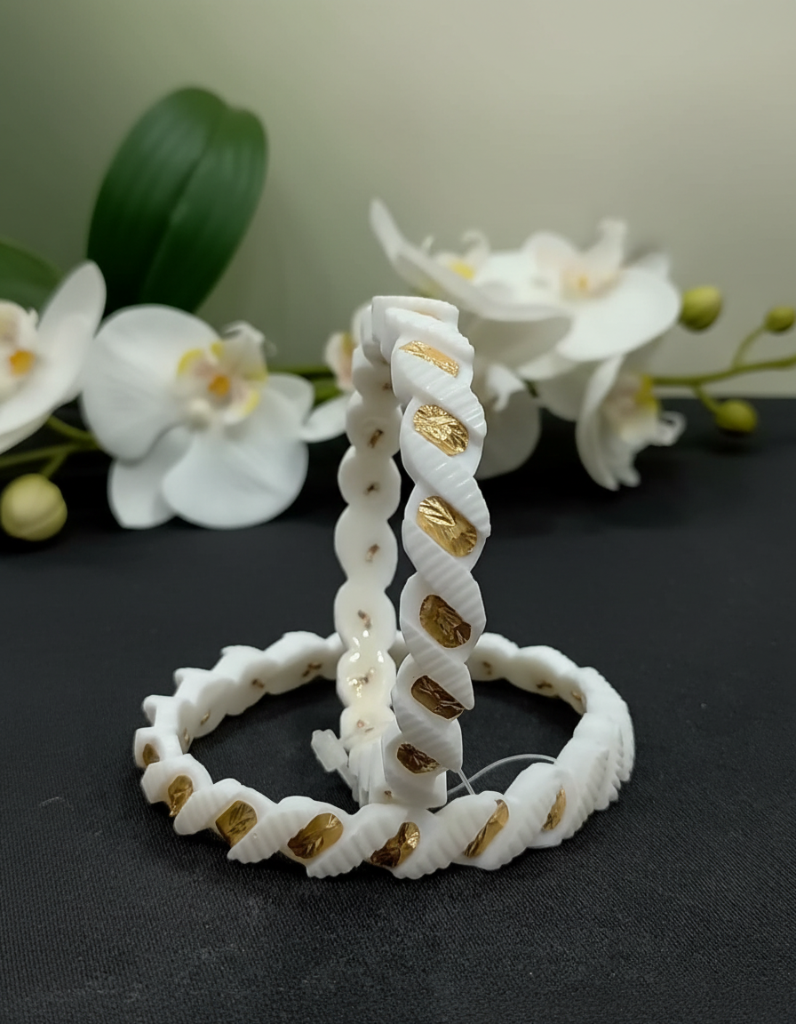 Twisted white shell bangles inlaid with gold-plated